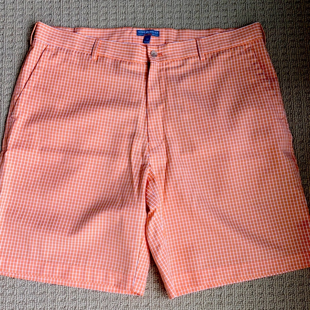 Peter Millar wicking golf short. Orange and white